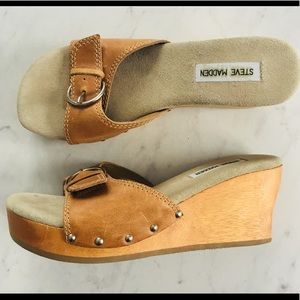 Steve Madden wooden platform sandals.